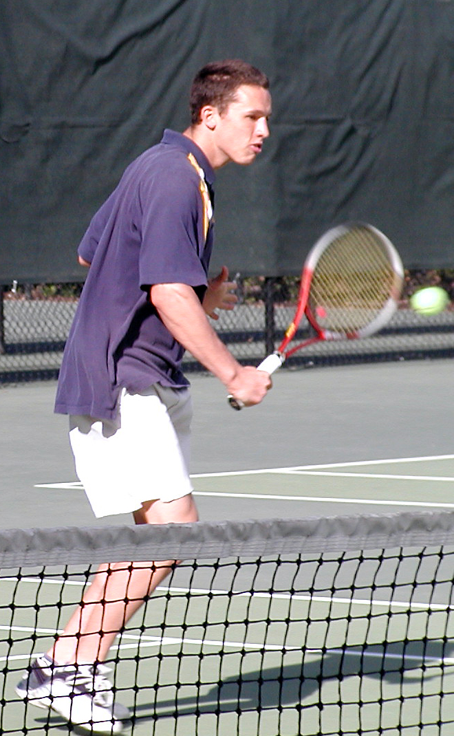 Karl Blunden '04 sticks a backhand volley.
