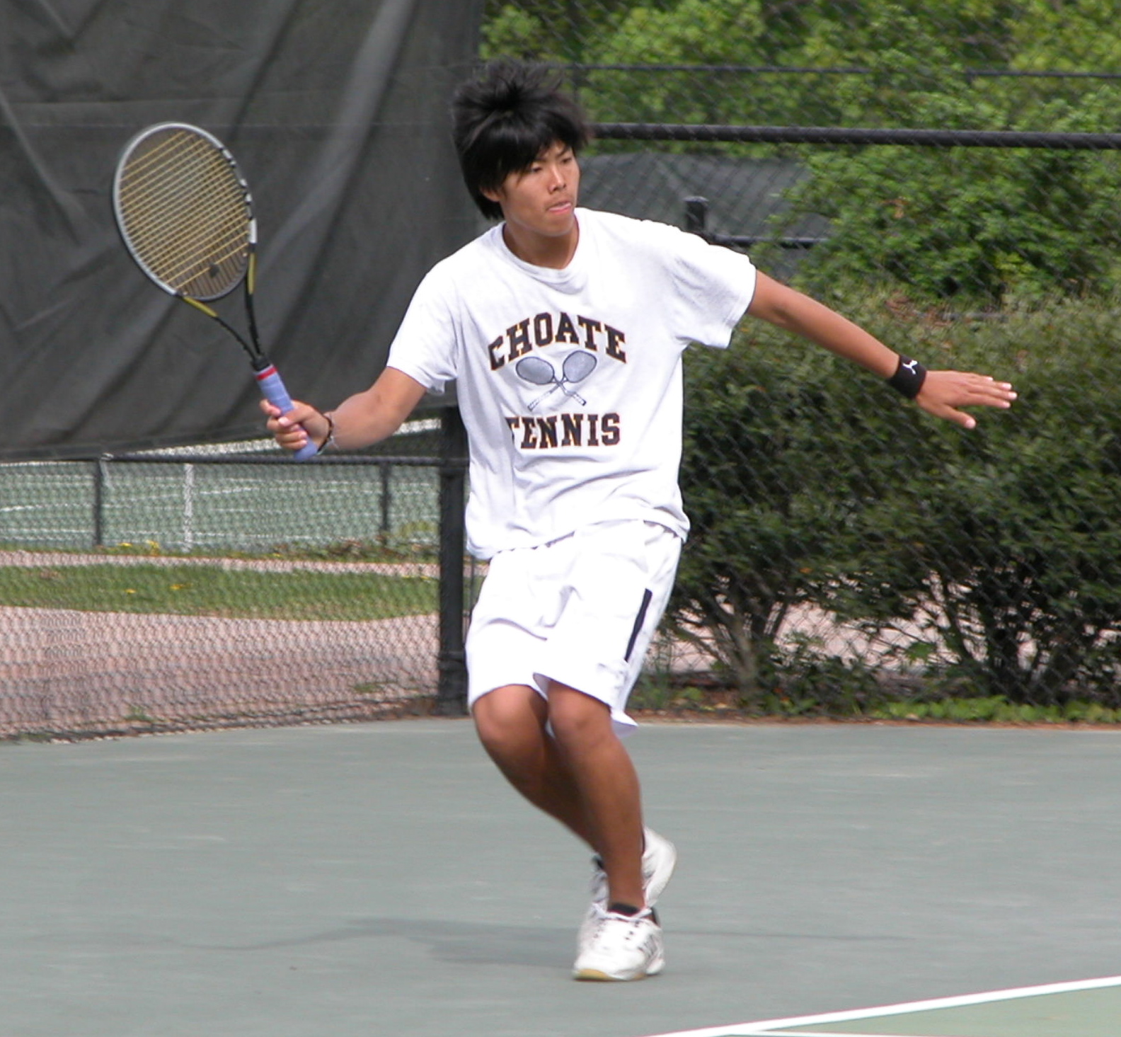 Ming Ong '05 lines up a forehand.